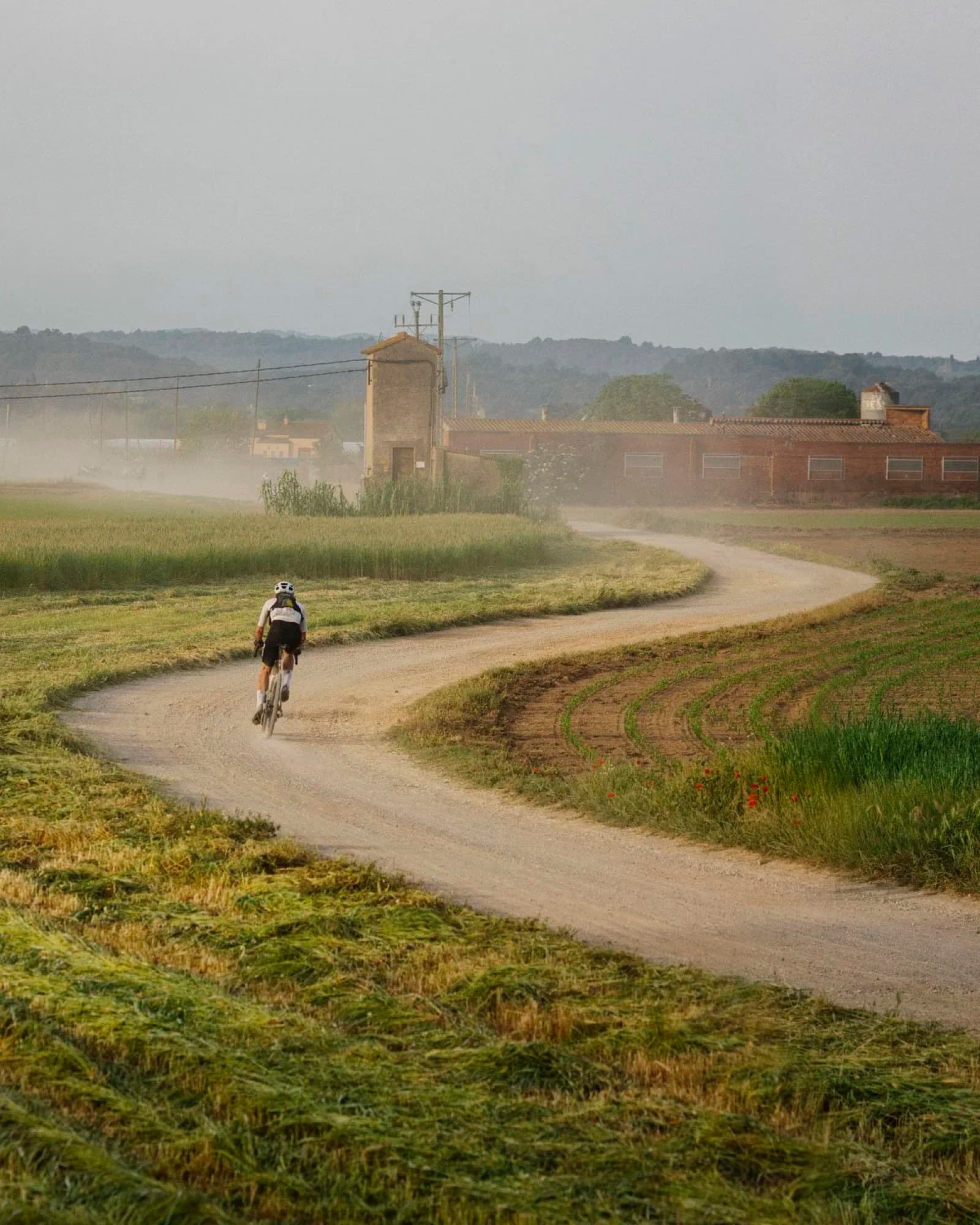 Misty gravel road at dawn
